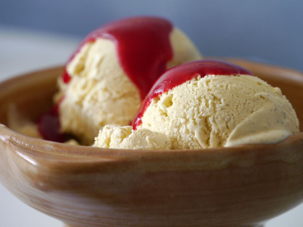 ice cream with red sauce in bowl