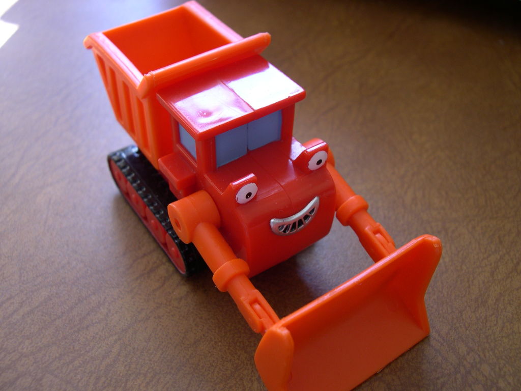 toy truck with cartoon face