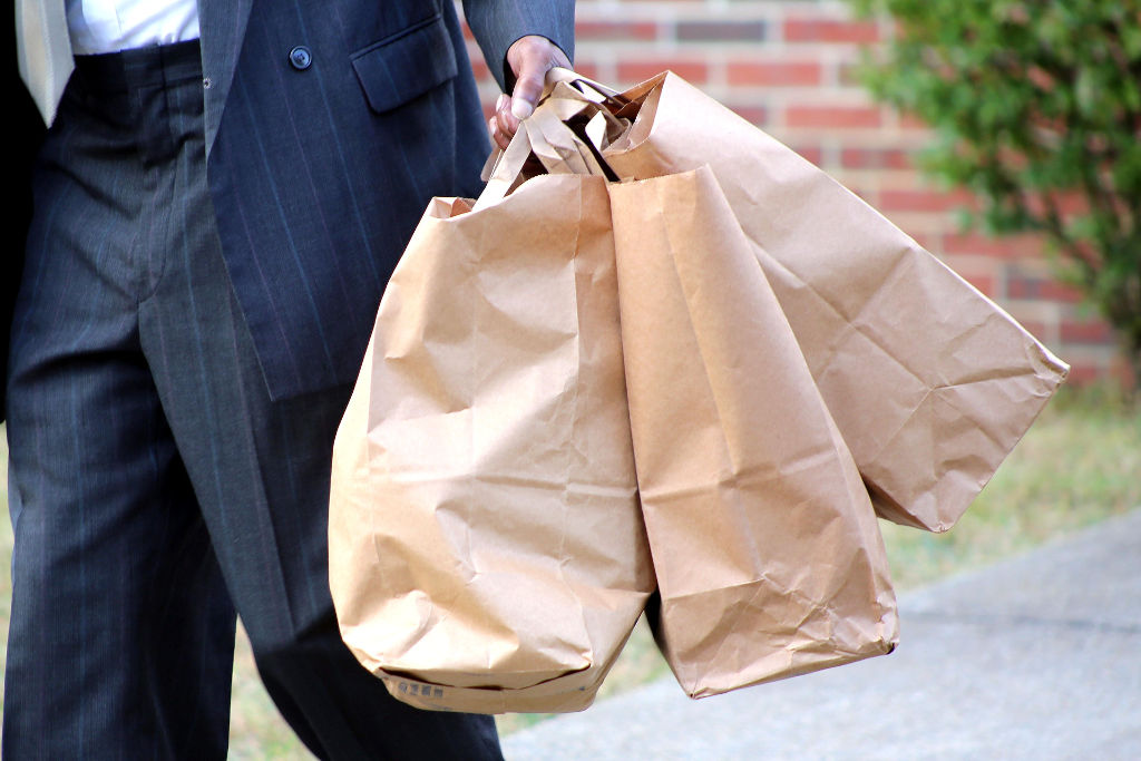 man carrying groceries