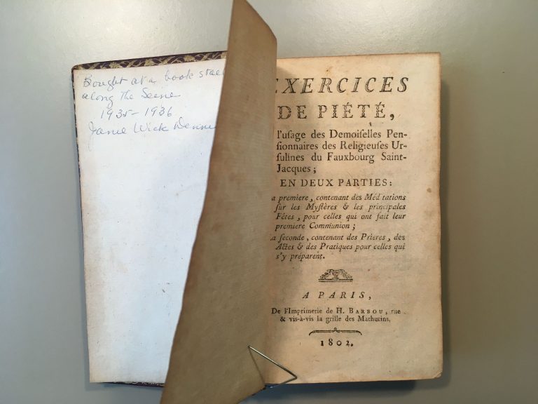 Old book showing inscription on inside cover