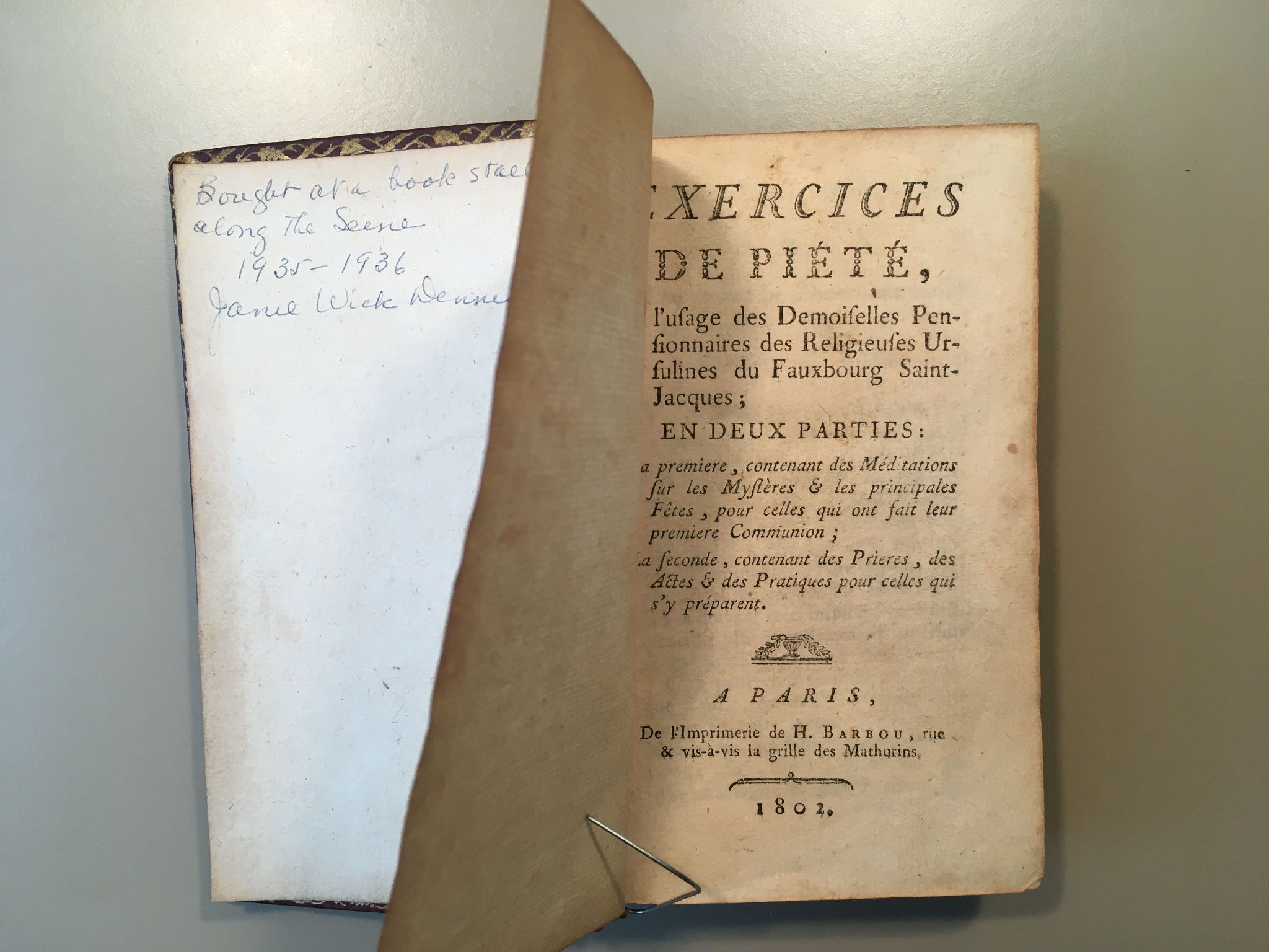 Old book showing inscription on inside cover